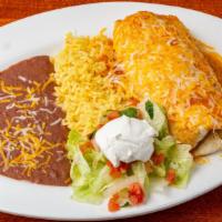 Beef Burrito · A large flour tortilla with beef and melted cheese. Topped with red chili sauce and served w...