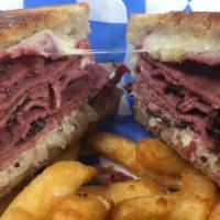 Pastrami Reuben · Lean pastrami, swiss, homemade 1000 island and sauerkraut on grilled rye.