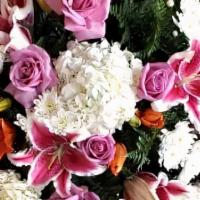 Funeral Spray · Beautiful display of white hydrangeas, Asiatic lilies, stargazer lilies, and lavender roses,...