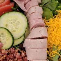 Chef Salad · Garden salad, ham, turkey, bacon, cheese.