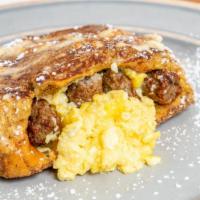 Stuffed French Toast · Stuffed with eggs & Turkey sausage. Covered in Cinnamon Sugar!