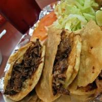 Taco Solamente · Folded tortilla with a variety of fillings such as meat or beans.