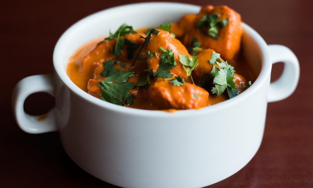 Chicken Tikka Masala · Barbequed chicken cooked in tomato sauce served with basmati rice.