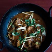 Lamb Kadai · Lamb cooked with fresh ginger, garlic cilantro, diced tomatoes, with house spices, served wi...