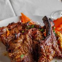 Tandoori Lamb Chops · Seasoned in freshly ground spices, then roasted in our clay oven.