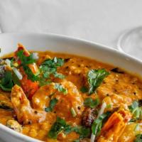 Shrimp Moilee · Shrimp poached in coconut sauce, flavored with curry leaves and mustard seeds.
