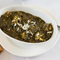 Palak Paneer · Has nuts. Fresh homemade cheese cooked in a creamy spinach sauce.