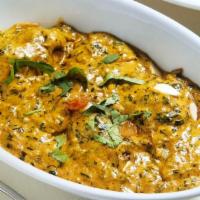 Palak Kofta · Has nuts. Shallow fried spinach dumplings cooked in a creamy sauce.