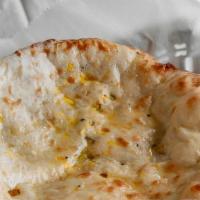 Amritsari Kulcha · Light and fluffy white flour bread, baked in tandoor and buttered.