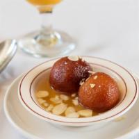 Gulab Jamun · Vegetarian. Reduced milk balls served in rose flavored sugar syrup and a touch of cardamom.