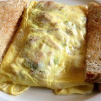 Egg Omelet · Three eggs with your choice of the following: bacon, sausage, ham, onion, peppers, olives, m...