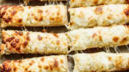 Cheesy Bread Stix · Garlic buttery breadstix topped with our four cheese blend, topped with garlic parmesan seasoning. Served with marinara sauce.