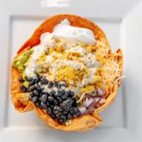 Taco Salad · Fry bowl tortilla with lettuce, beans, pico de gallo, sour cream, carrots, guac.