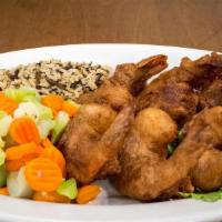 Fried Shrimp · 6 jumbo prawns dipped in homemade batter and fried.  Served with choice of starch and steame...