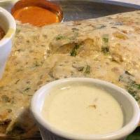 Rava Masala Dosa · Combination of rice and sooji crepe stuffed with southern potato mixture, cooked on Indian g...