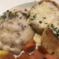 Crab Cakes · Crab and Oregon Bay shrimp blended with light spices topped with lobster cream sauce.