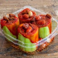 Pepino Locos · Cucumber made into cups, dipped in chile powder, filled with mango, jicama, cucumber, Japane...