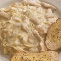 Chicken Alfredo · Chicken cubes tossed with fettuccine pasta in a creamy sauce.