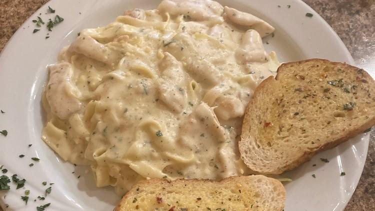 Chicken Alfredo · Chicken cubes tossed with fettuccine pasta in a creamy sauce.