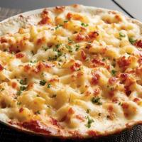 White Cheddar Lobster Mac & Cheese · Live Maine lobster sautéed with butter and Old Bay Seasoning combined with elbow macaroni an...