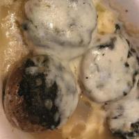 Stuffed Mushrooms · Silver dollar mushroom caps filled with sausage & spinach. Topped with melted mozzarella che...