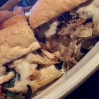 Cheesesteak · Shaved Ribeye or Chicken With Provolone Cheese Fried Onion Lettuce Tomato And Mayo