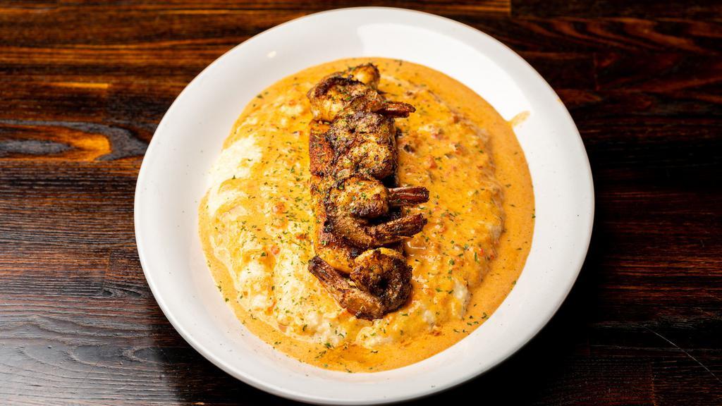 Blackened Salmon With Shrimp & Grits · Blackened salmon with shrimp & grits (rice optional). made with our creamy cheese grits topped with blackened shrimp & creole sauce.