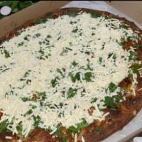 Armenian Pizza · Garlic, olive oil, oregano sauce, feta cheese, tomato, cilantro and basil.