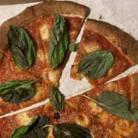 Margherita Pizza · Served with tomato sauce, fresh mozzarella cheese and basil.