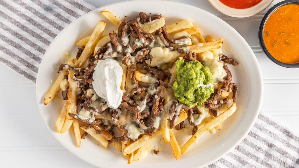 Papas Locas · Fries topped with your choice of meat, melted cheese, sour cream and jalapeños.