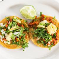 Street Tacos · Two Corn tortillas filled with your choice of meat, onions, cilantro & salsa.