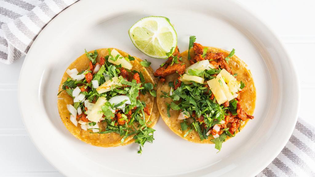 Street Tacos · Two Corn tortillas filled with your choice of meat, onions, cilantro & salsa.