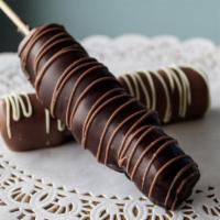 Marshmallow Kabob · Marshmallows skewered and hand-dipped in chocolate, available in milk or dark chocolate.