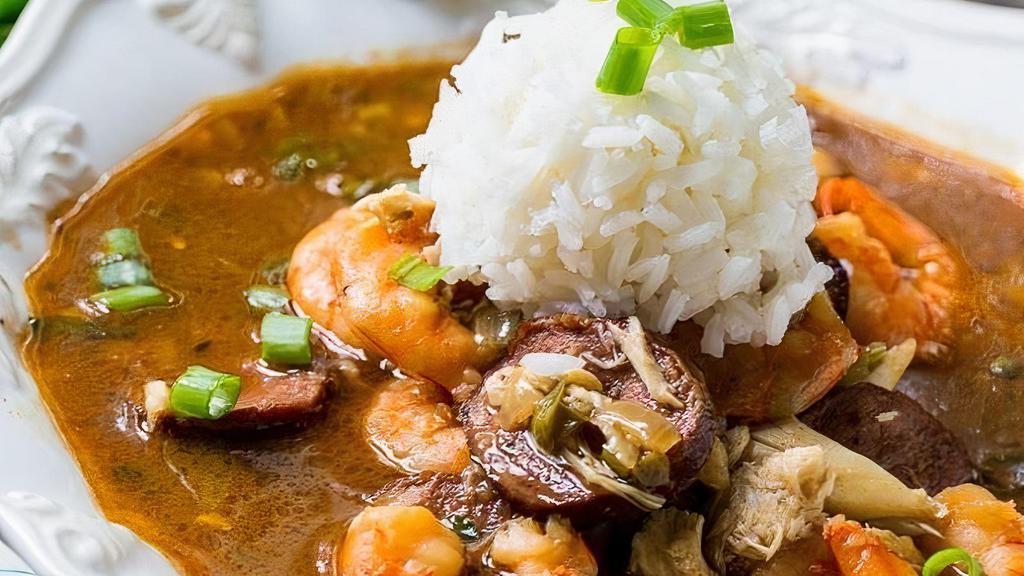 Seafood Gumbo · A traditional Louisiana gumbo with shrimp, crawfish, crab, & andouille sausage.