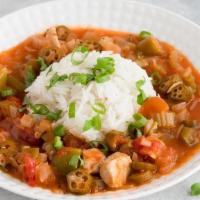 Chicken Gumbo · A traditional Cajun gumbo made with seasoned roux, tender chicken, & andouille sausage.