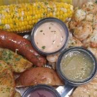 Cajun Surf & Turf Shrimp · Pork tenderloin, 1 lb. shrimp, corn, potatoes, & sausage.