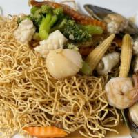Seafood Golden Noodle · Seafood combination with broccoli, carrot, baby corn sautéed with our gravy sauce, served on...