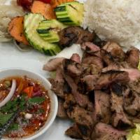 Moo Yang · Thai style pork steak grilled and served with special lime dressing.