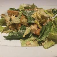 Caesar'S Salad · Romaine lettuce tossed in a traditional Caesar dressing with diced sharp provolone cheese, c...