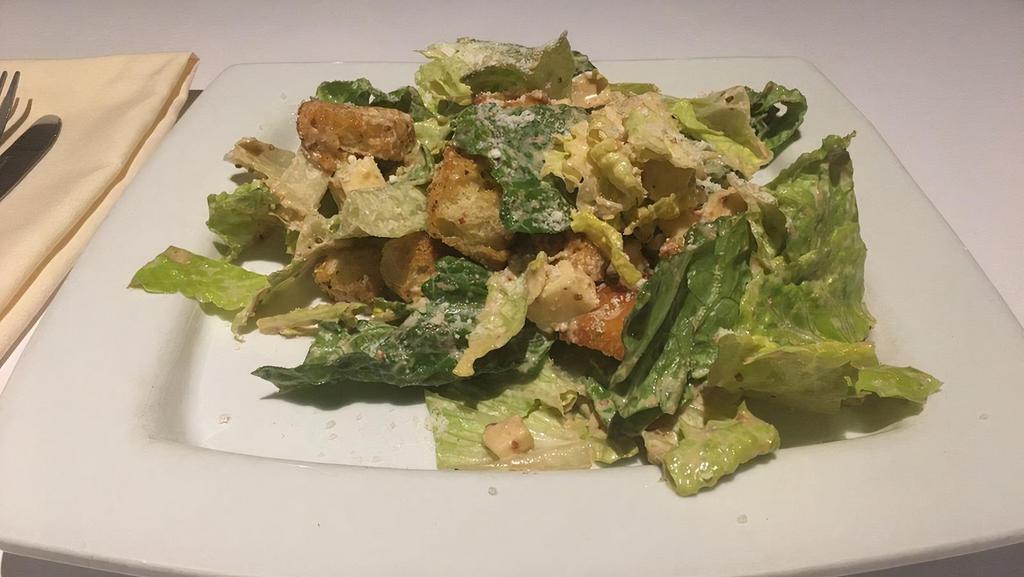 Caesar'S Salad · Romaine lettuce tossed in a traditional Caesar dressing with diced sharp provolone cheese, croutons and finished with fresh grated cheese.