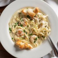 Shrimp Scampi Pasta · Fettuccine, oil, garlic, and seared shrimp with lemon and parsley. Hearty portions that and ...