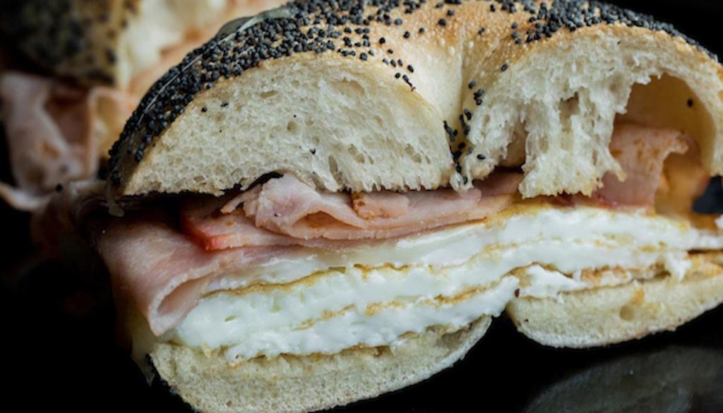 The Skinny Ham · Free to sub bagel w/ another type of bread. Poppy bagel scooped, skinnied & toasted, sliced Virginia ham, Swiss chs, 3 egg whites, scrambled