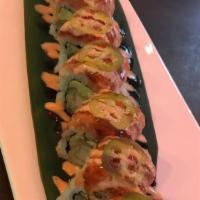 Phoenix Roll · Shrimp tempura with avocado top with spicy tuna, jalapeño, eel sauce, and spicy mayonnaise.