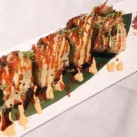 Sp23. Tiger Roll · With soy paper, salmon avo, seaweed salad, cucumber, spicy mayo, eel sauce, hot chili sauce.