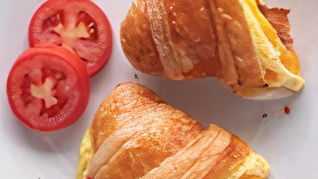 Breakfast Croissant · Scrambled eggs and your choice of bacon, turkey, sausage or ham and cheddar on a butter croissant.