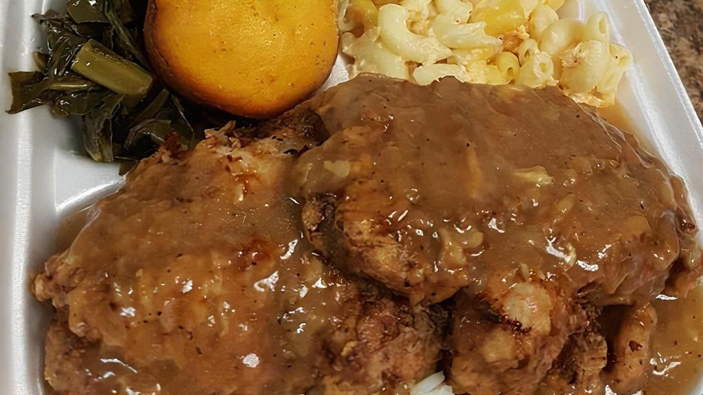 Smothered Pork Chops Plate · Comes with three sides and two pieces of cornbread.