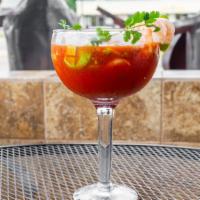 Shrimp Cocktail · Large shrimp in our special recipe. Served with tomato sauce, fresh onions, cilantro and avo...