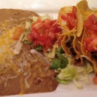 Taco Platter · Three deep fried tacos with lettuce, tomatoes and cheese. Served with rice and beans.