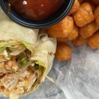 Buffalo Chicken Wrap · Diced lightly breaded chicken breast tossed with spicy Buffalo sauce, lettuce, tomato, chees...