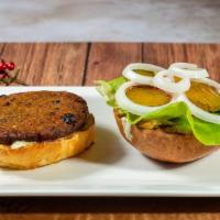 Spicy Black Bean Burger · Bibb lettuce, sliced cucumber, tomato, sprouts, herb mayo, and harissa ketchup.